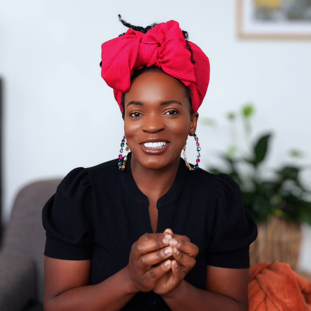 Faith Liz smiling in a red headwrap